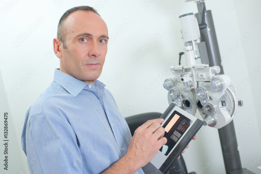 Optician preparaing equipment