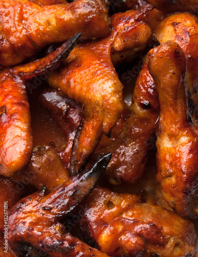 Close up of chicken wings in sauce