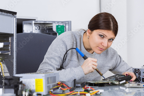 Wallpaper Mural woman technician fixing computer motherboard Torontodigital.ca
