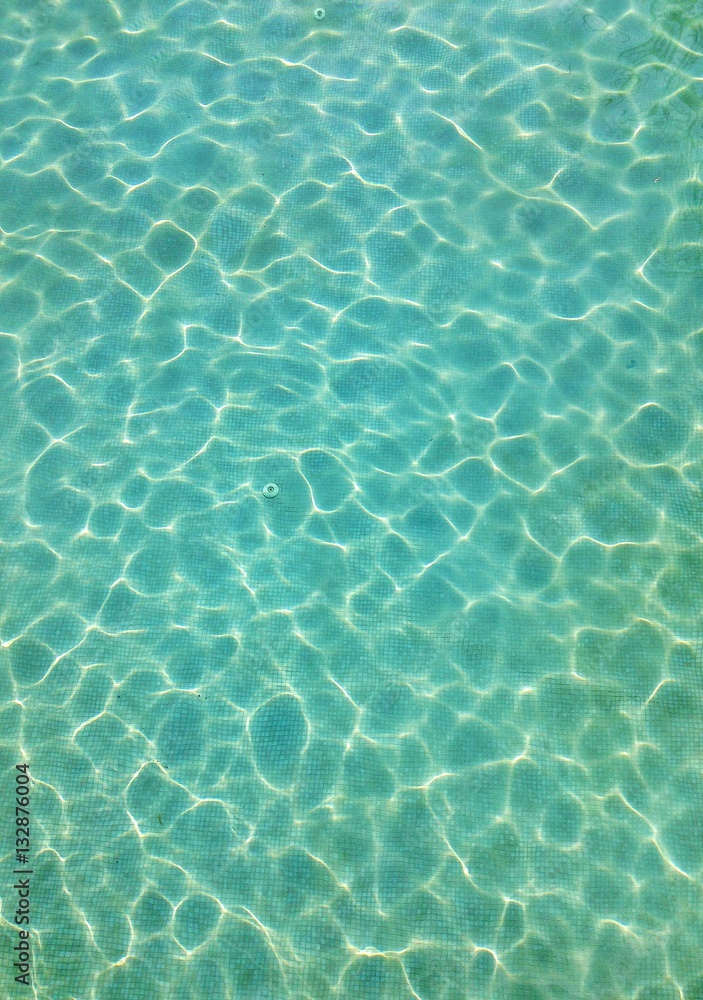 Swimming pool with lights reflection texture background 