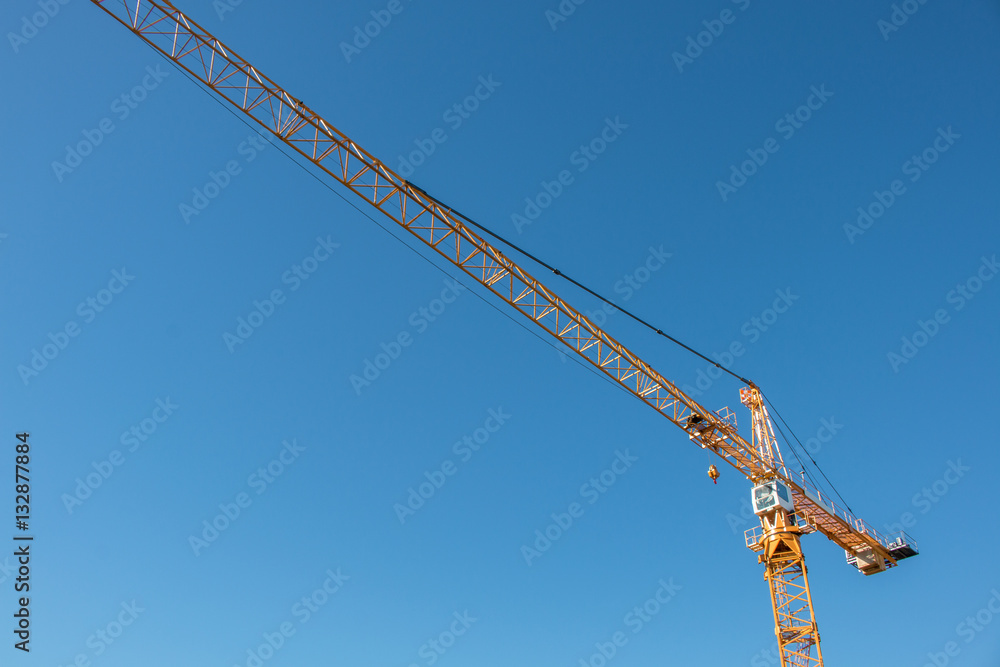 Construction Crane Against Bright Blue Sky Construction Crane Against Bright Blue Sky