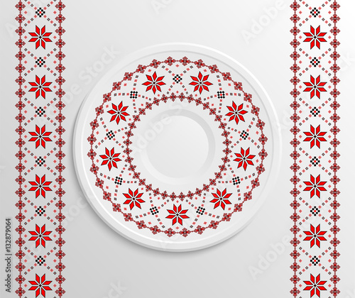 Table appointments in restaurant.. Decorative plate with round ethnic ornament. Ukrainian style.  Traditional pattern. Vintage background of napkin.
