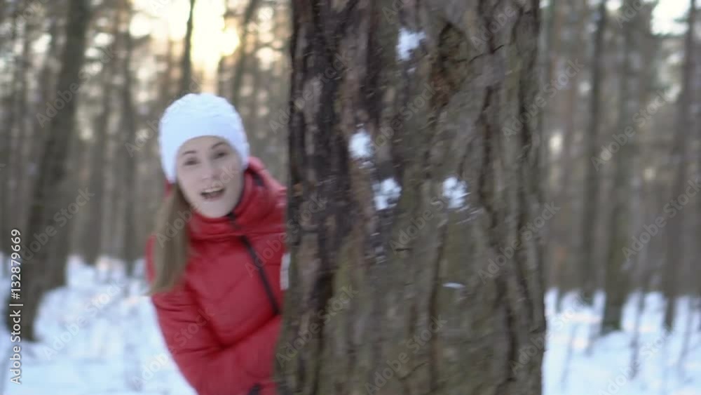 Attractive young woman in the winter park, playing snowballs, having fun, smiling. Slow motion video Attractive young woman in the winter park, playing snowballs, having fun, smiling. Slow motion video