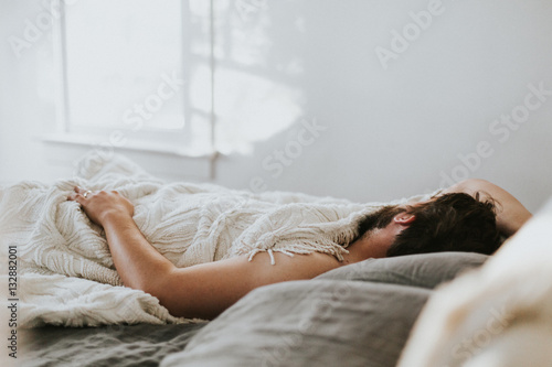 Man sleeping in bed photo