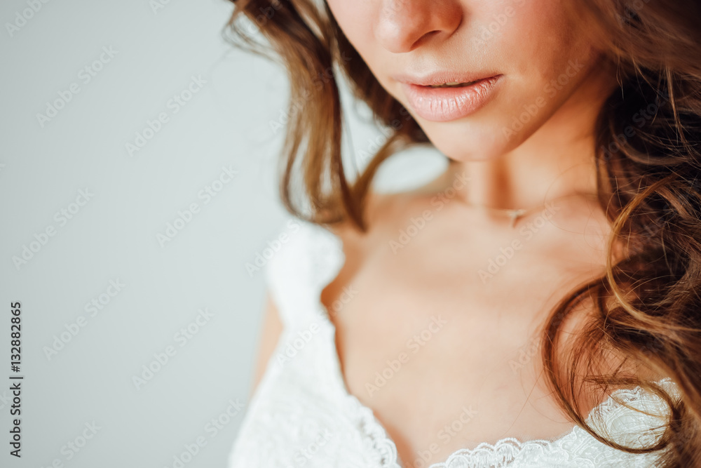 Wedding hairstyle and make up. Stylish hairstyle curls done in a beauty salon. Fashion, cosmetics and makeup. Part of face, young woman close up. Sexy plump lips Wedding hairstyle and make up. Stylish hairstyle curls done in a beauty salon. Fashion, cosmetics and makeup. Part of face, young woman close up. Sexy plump lips