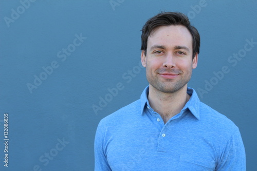 Striking man smiling close up with copy space