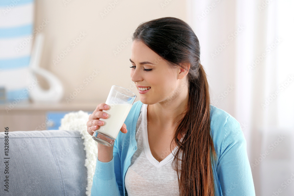 Young attractive woman drinking milk, closeup Young attractive woman drinking milk, closeup