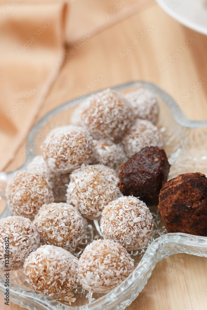 Truffles and chocolate balls with coconut flakes Truffles and chocolate balls with coconut flakes