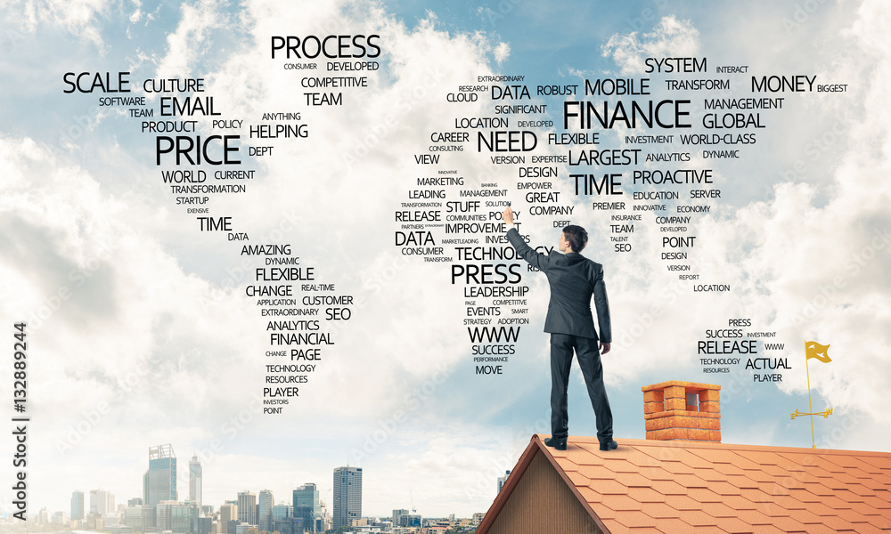 Businessman on brick roof draw world map as concept of globaliza Businessman on brick roof draw world map as concept of globaliza