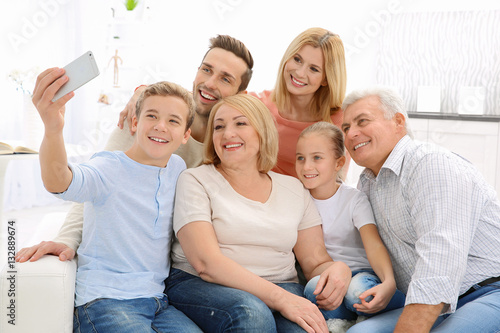 Happy family taking selfie ...
