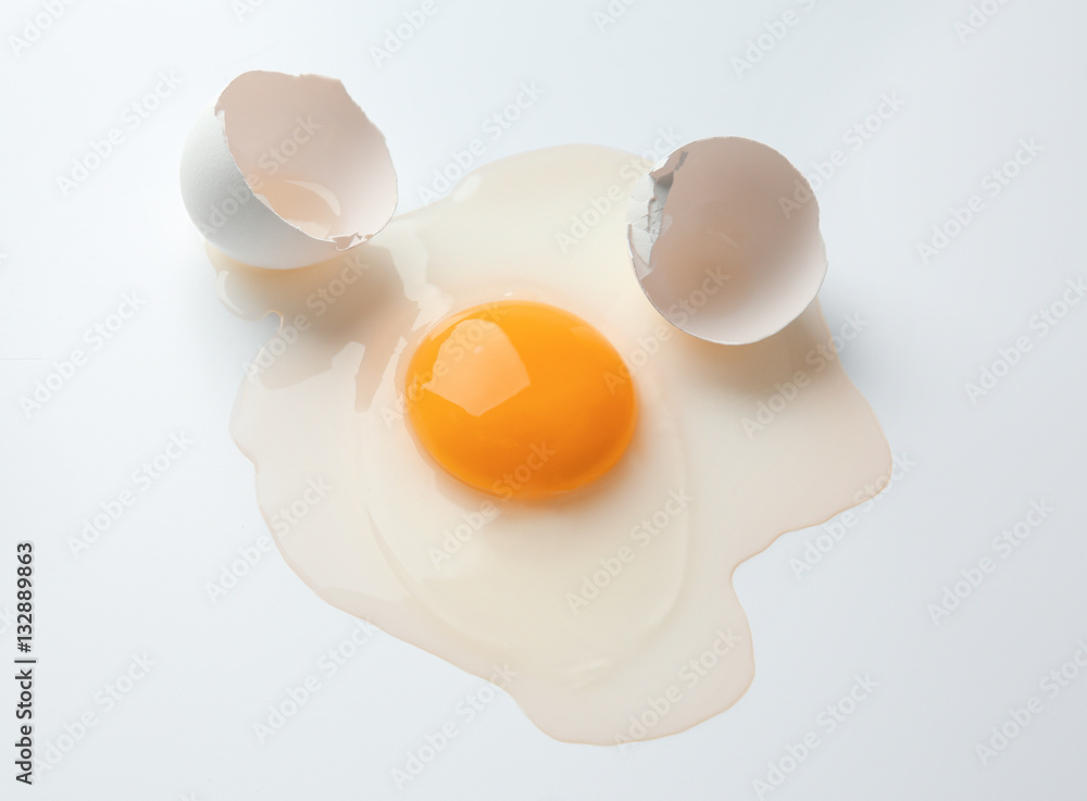 Raw egg yolk on white background Raw egg yolk on white background