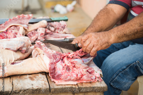 Man Cutting Meat