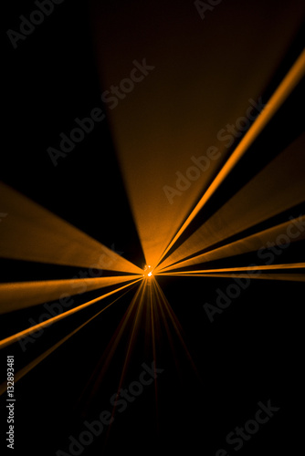 Fototapeta Naklejka Na Ścianę i Meble -  Laser beam orange on a black background