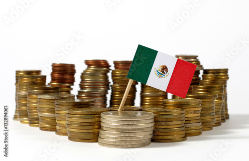 Mexico flag waving with stack of money coins