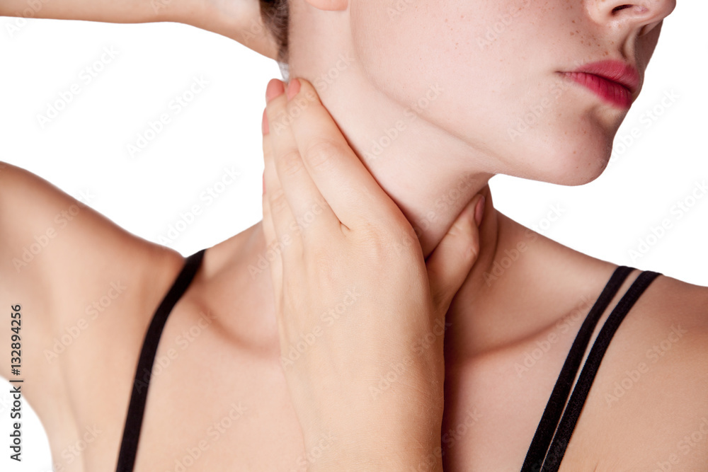 Closeup view of a young woman with pain on neck or thyroid gland. isolated on white background.
