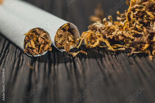 Wallpaper Mural homemade cigarettes and tobacco on the brown wooden table, close up with copy space Torontodigital.ca