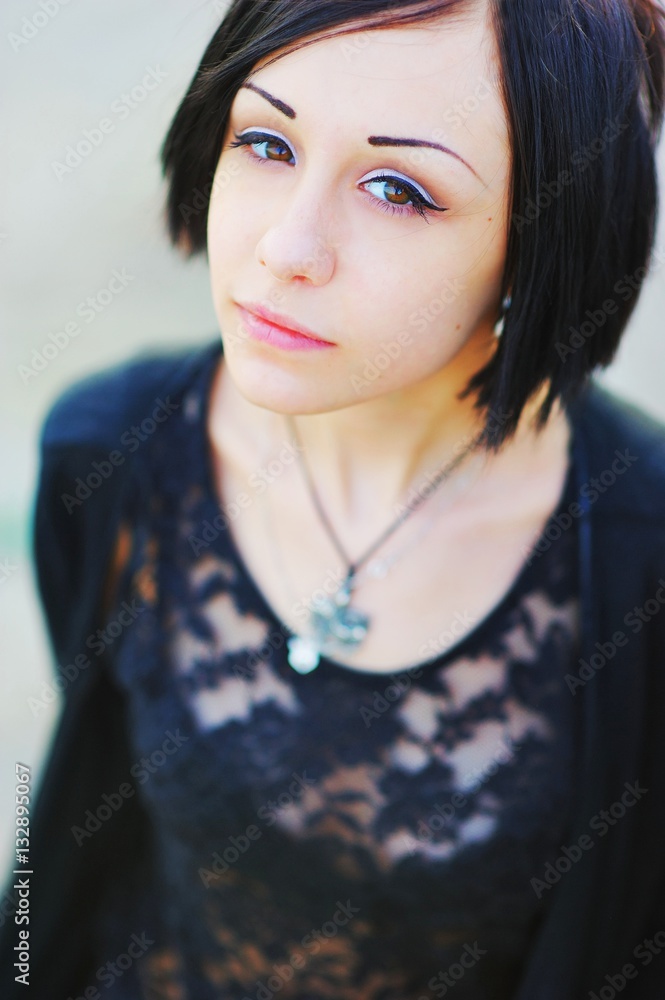 portrait of bright beautiful young brunette woman looking at camera, outdoors, close-up. portrait of bright beautiful young brunette woman looking at camera, outdoors, close-up.