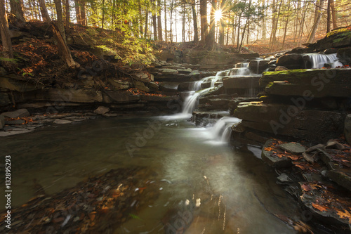 Sun shinning on Wolf Creek Falls photo