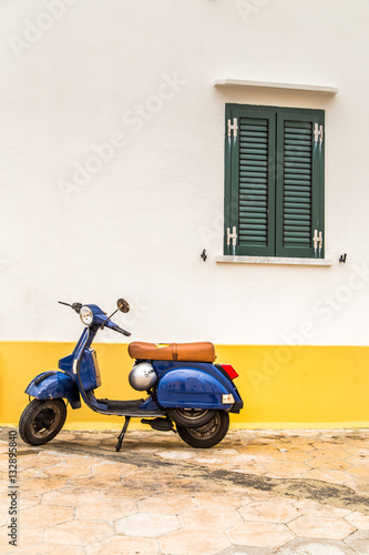 Fototapeta Scooter parked on old street in Bari, Italy