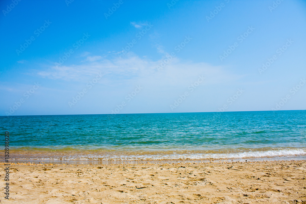Adriatic Sea coast view. Seashore of Italy, summer sandy beach with clouds on horizon.