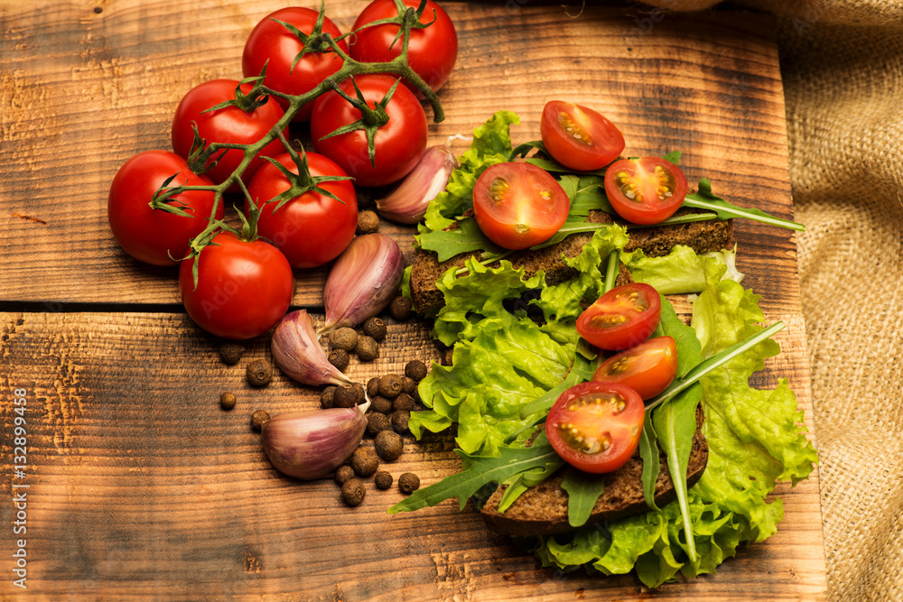 sandwich with tomatoes and arugula sandwich with tomatoes and arugula