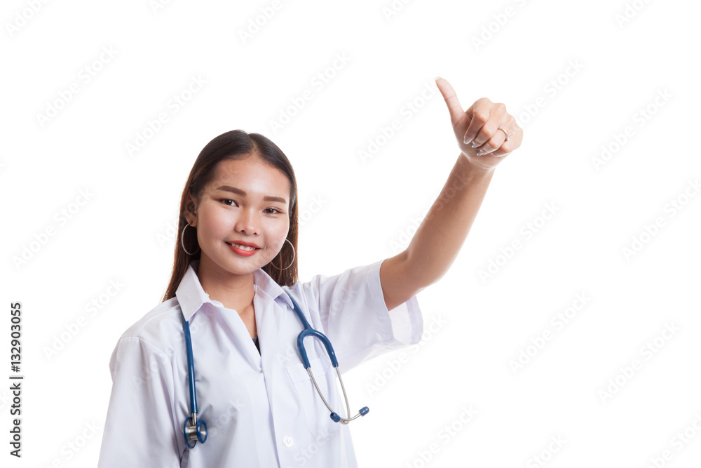 Young Asian female doctor show thumbs up. Young Asian female doctor show thumbs up.