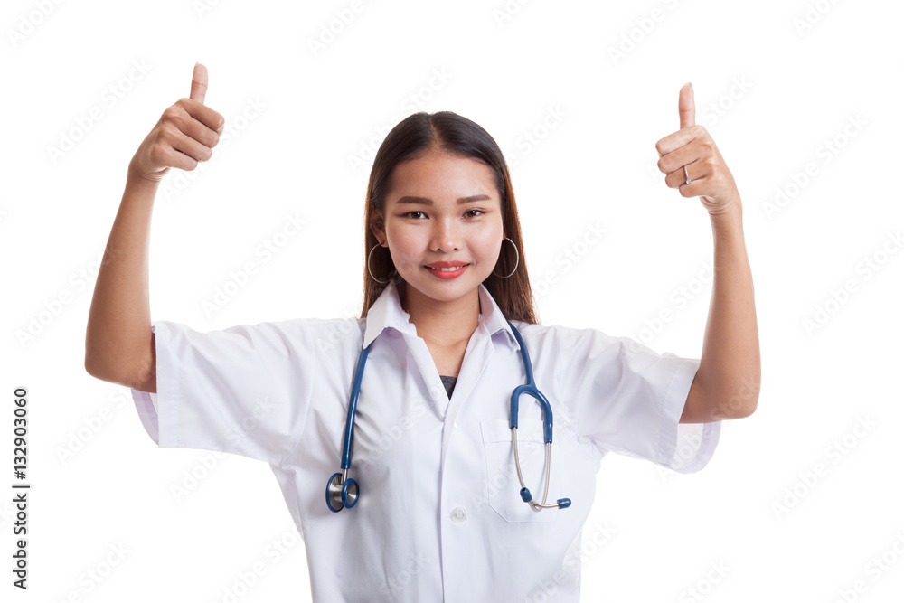 Young Asian female doctor show two thumbs up. Young Asian female doctor show two thumbs up.