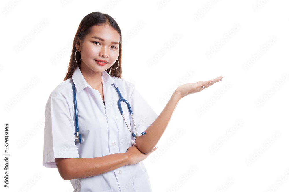 Asian young female doctor show something on her hand. Asian young female doctor show something on her hand.