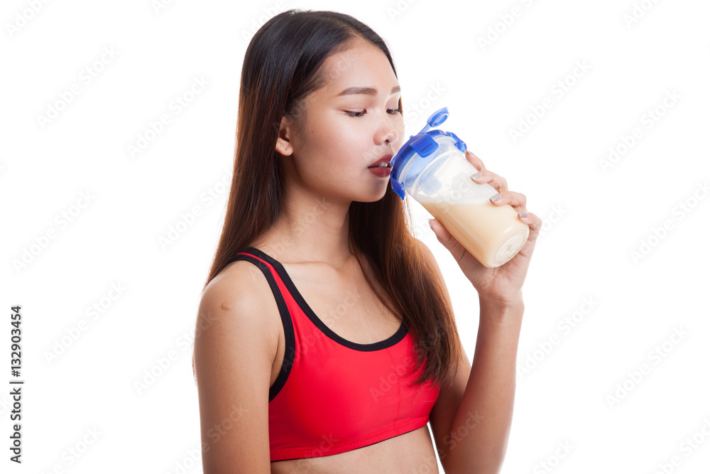 Beautiful Asian healthy girl drinking whey protein. Beautiful Asian healthy girl drinking whey protein.