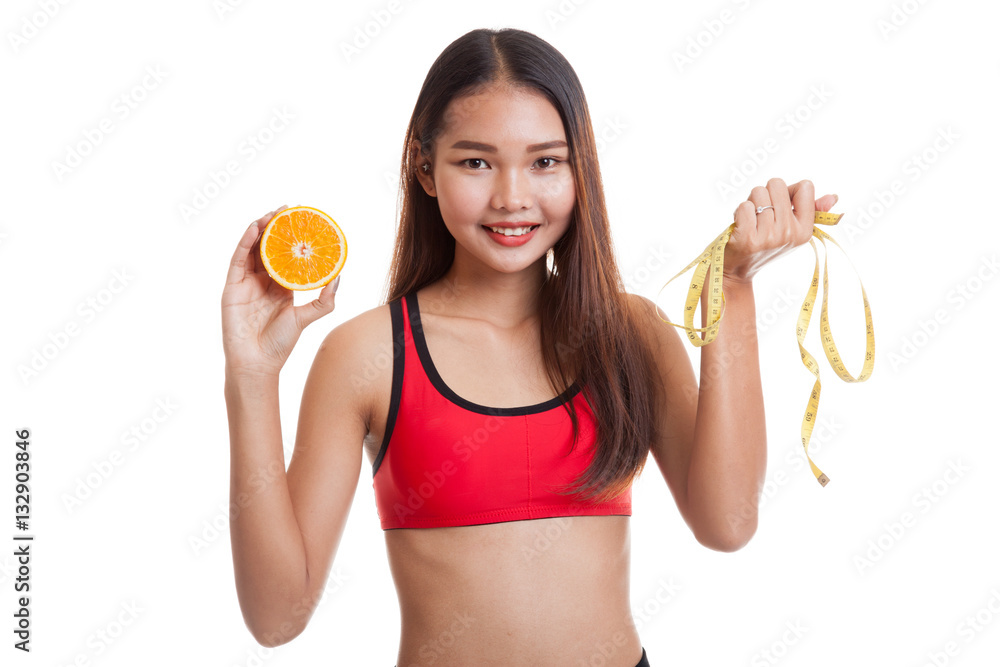 Asian healthy girl on diet with orange fruit and measuring tape. Asian healthy girl on diet with orange fruit and measuring tape.
