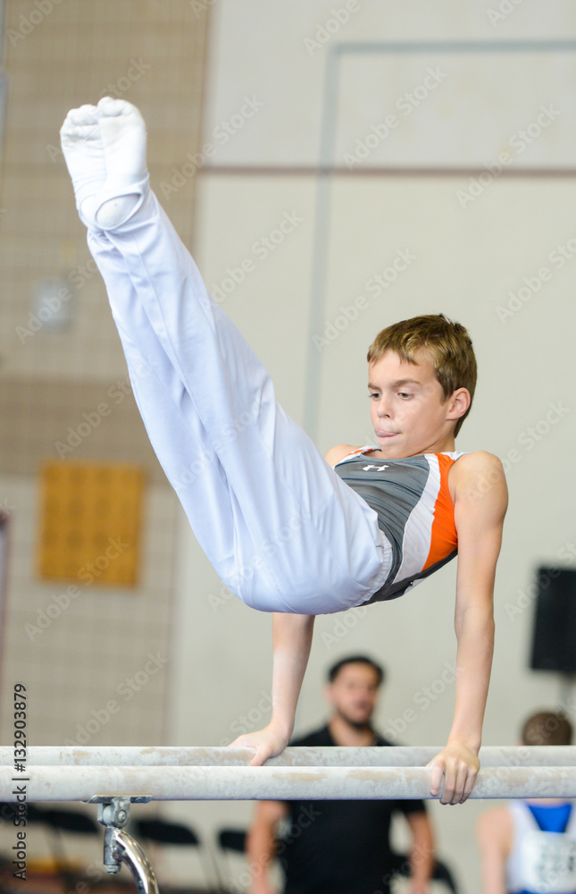 Fototapeta premium Gymnast on paralel bars