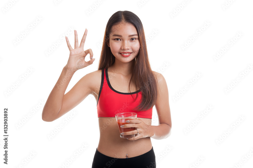Beautiful healthy Asian girl show OK with tomato juice. Beautiful healthy Asian girl show OK with tomato juice.