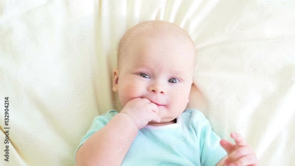 Joyful baby's portratit lying in bed, Joyful baby's portratit lying in bed,