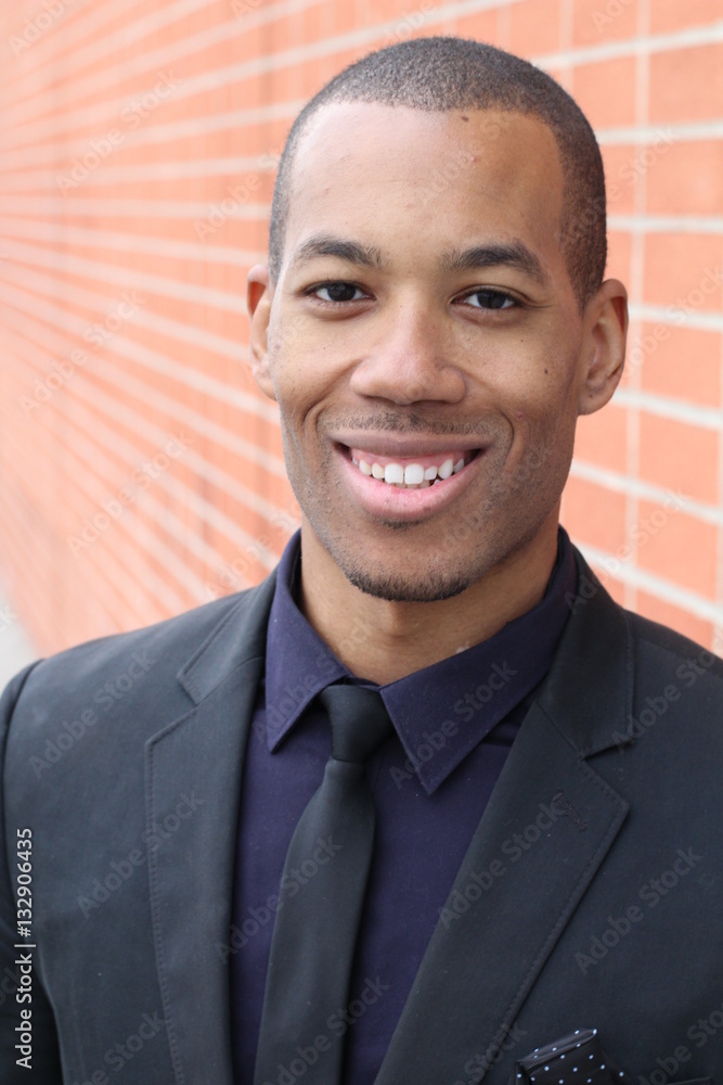 Close-up of smiling young, dark-skinned businessman Close-up of smiling young, dark-skinned businessman