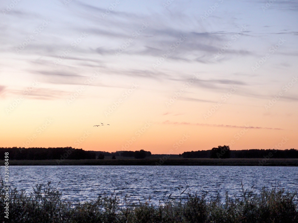 Fototapeta premium Sunrise over a lake
