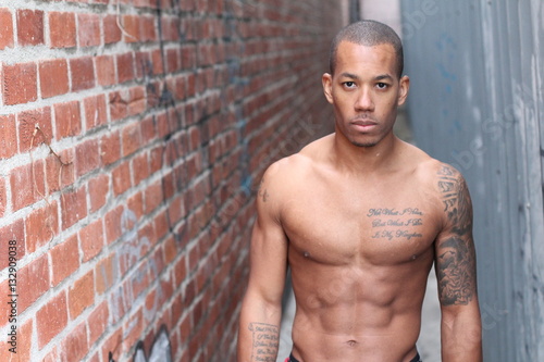 Sensuous African American man shirtless with copy space