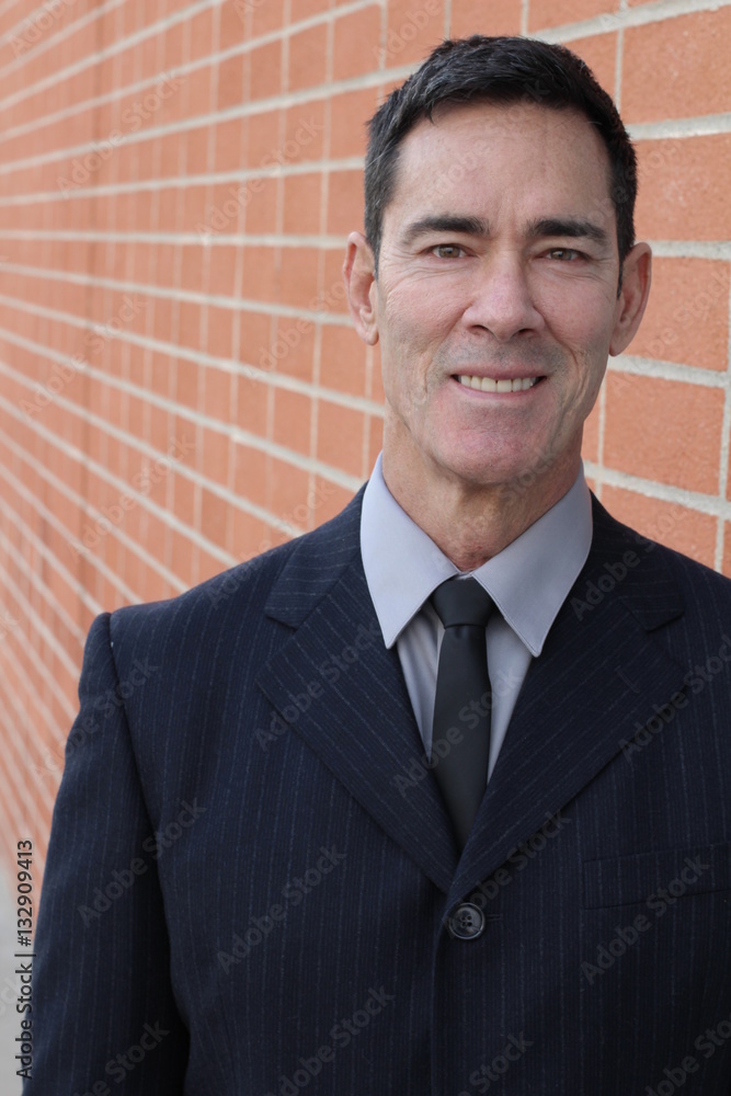 Handsome mature businessman smiling and laughing Handsome mature businessman smiling and laughing