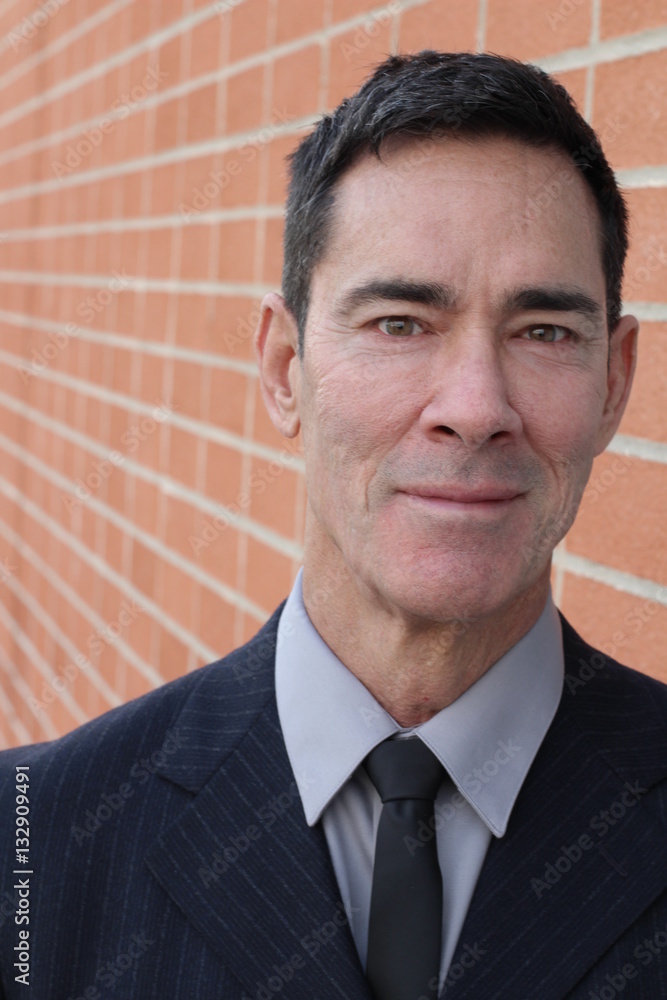 Mature handsome Caucasian businessman smiling Mature handsome Caucasian businessman smiling