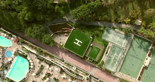 AERIAL: rotation shot of a square helicopter parking spot. photo