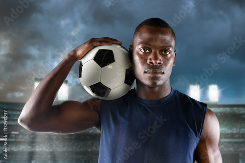 African American Footballer Holding Ball