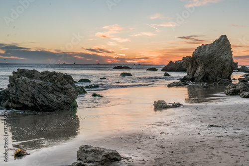 Sunset over the Pacific Ocean and the rocks at El Matador State Beach near Malibu California