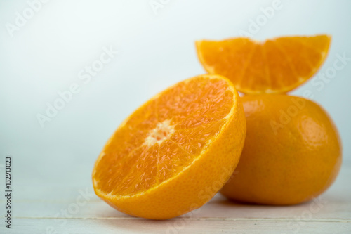 Oranges  close up whole orange fruit and sliced oranges on wood