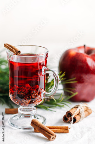 Food background of ingredients for winter drink or tea with cinnamon, raisins and apple Christmas New year postcard