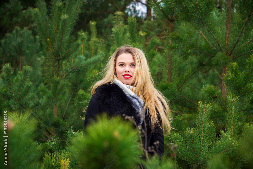 Naklejka premium Woman posing in pines