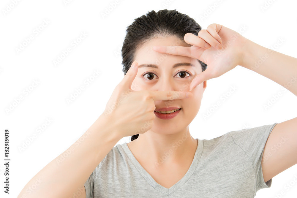 Beautiful asian woman gesturing finger making frame with hands Beautiful asian woman gesturing finger making frame with hands