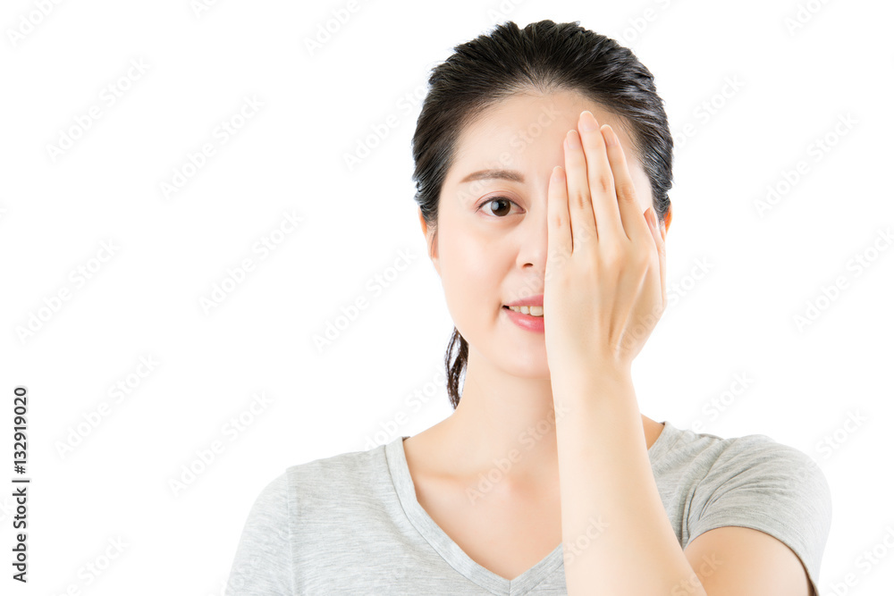 asian woman reviewing eyesight. closing one eye with hand asian woman reviewing eyesight. closing one eye with hand