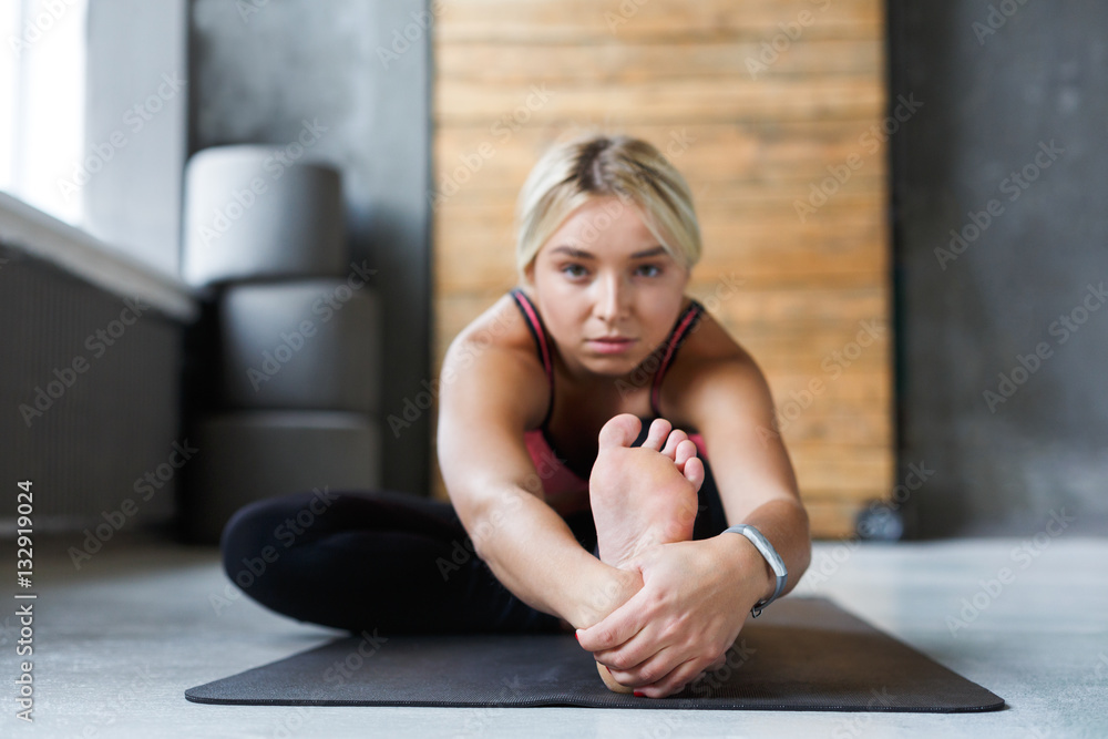 Sit Forward Woman makes yoga pose in class, sit forward bend asana Stock Photo ...