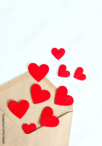 Red hearts pours out of the envelope. White background.
