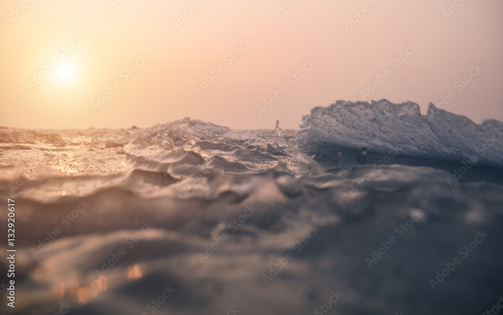 Small ice crystals on frozen sea. Selective focus and shallow depth of field.