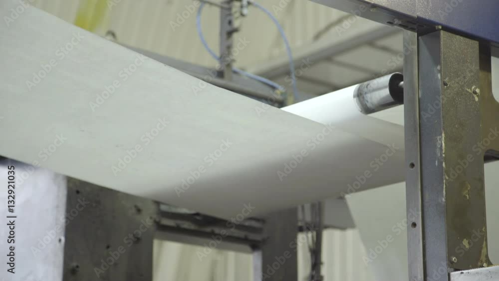 Scrolling of paper on press, close up Scrolling of paper on press, close up